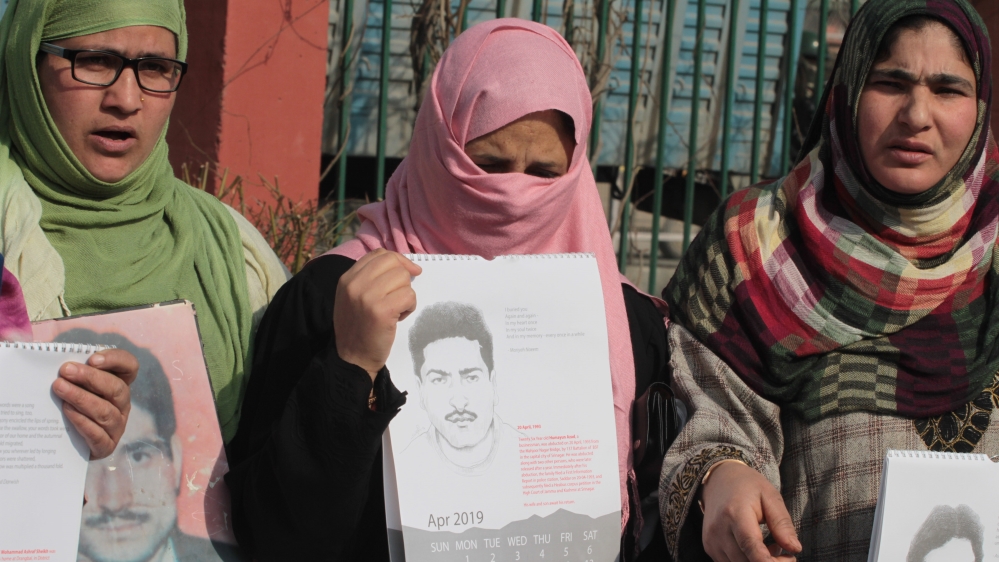 Safiya Azad, centre, said she kept her husband's half-smoked cigarette from the day he went missing [Shuaib Bashir/Al Jazeera]