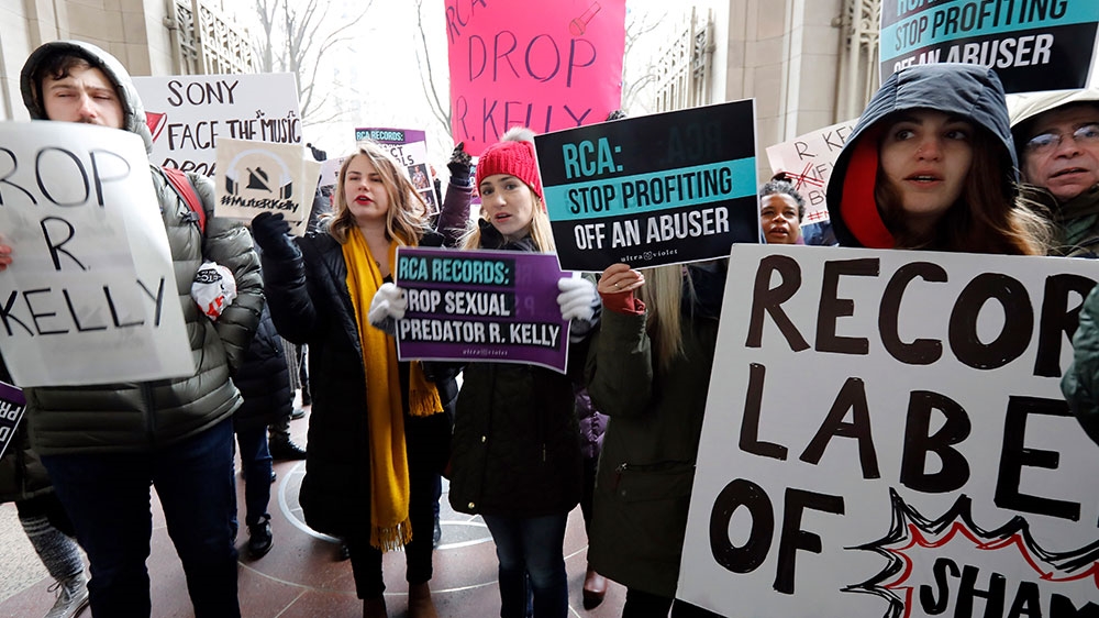 Demonstrators chant during an R Kelly protest outside Sony headquarters, in New York [Richard Drew/AP Photo]