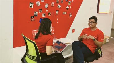 Trung Nguyen (right), CEO and founder of delivery platform Lozi, is among a new breed of Vietnamese entrepreneurs [Josh Doyle/Al Jazeera]