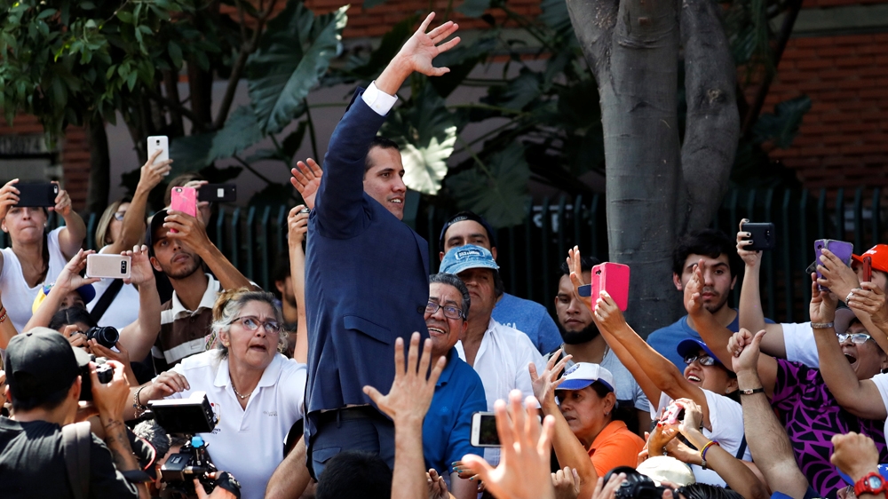 
Guaido, the leader of the opposition-controlled National Assembly, has declared himself interim president of Venezuela. [Carlos Garcia Rawlins/Reuters]
