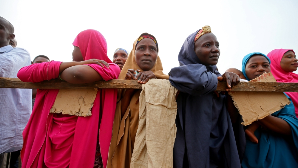 Women are seen waiting for the voting to start during Nigeria''s governorship and state assembly election in Karu