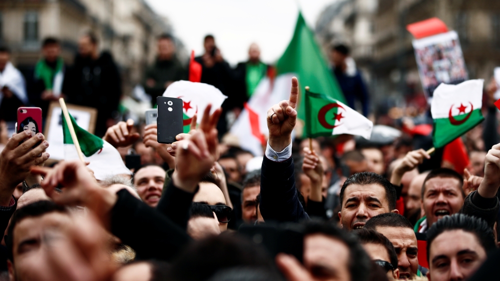 Demonstrators gather near the Monument to the Republic during a protest against Algerian President Abdelaziz Bouteflika seeking a fifth term in a presidential election in Paris