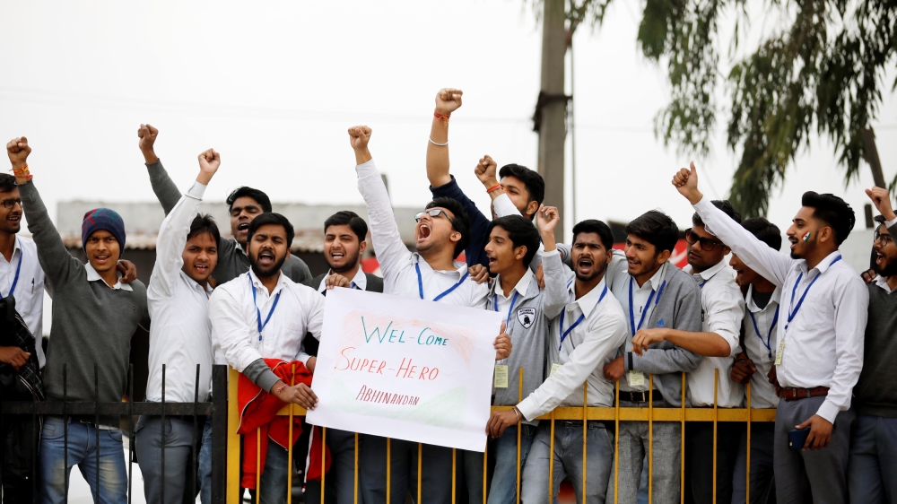 People shout slogans before the arrival of Abhinandan near Wagah border on Friday [Danish Siddiqui/Reuters]