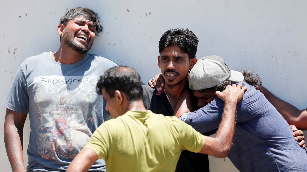 Relatives of a victim of the explosion at St Anthony's Shrine react at the mortuary in Colombo [Dinuka Liyanawatte/Reuters]