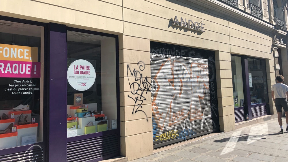 A closed shoe store on Saturday near the busy retail district of the Marais [Jabeen Bhatti/Al Jazeera]