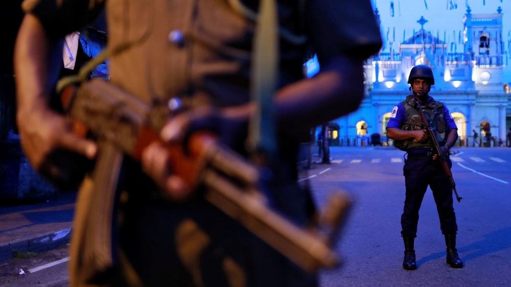 Security personnel stand guard in front of St Anthony's Shrine [Danish Siddiqui/Reuters]