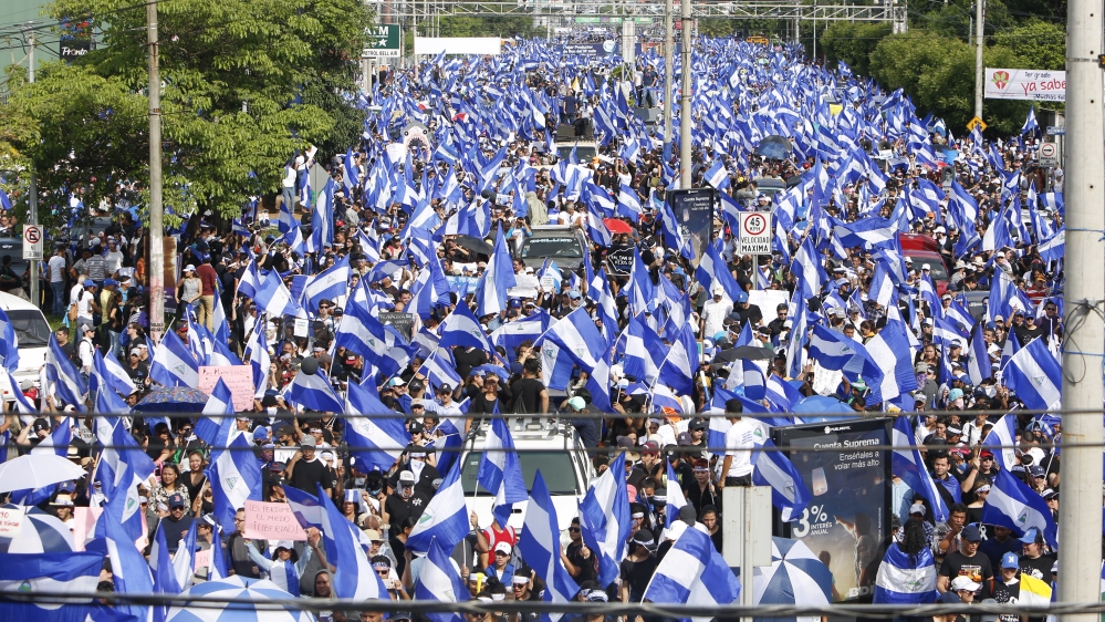 Protesters take part in the Mother's Day march in memory of the dead and disappeared in Managua, Nicaragua in May 2018. [Anadolu/Stringer] 