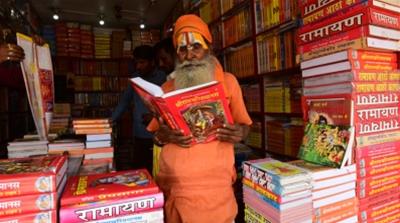 Bookseller Kailash Chandra Das says there is nothing wrong with mixing religion with politics [Amar Deep Sharma/Al Jazeera]