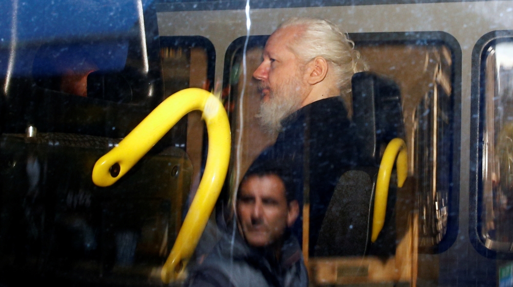 WikiLeaks founder Julian Assange is seen in a police van in London