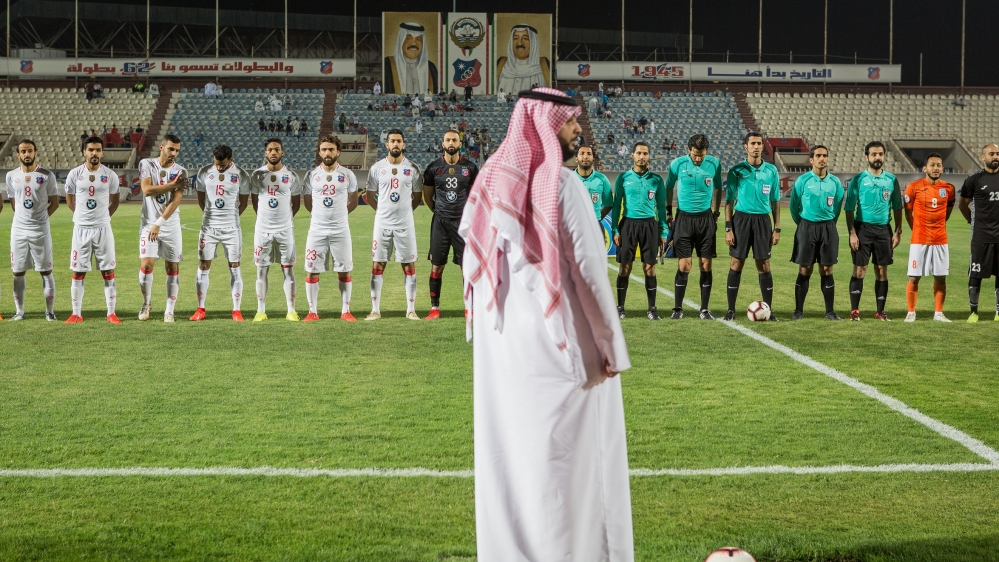 A member of the Kuwait Football Association (KFA) supervises a match of the Kuwait Premier League