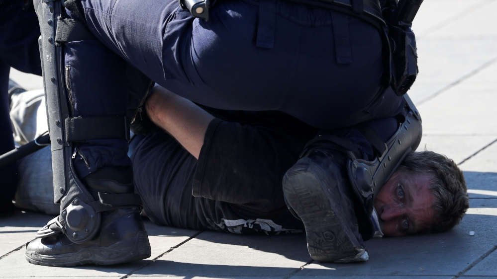 Police headquarters reported 126 arrests and 11,000 checks on individual protesters [Yves Herman/Reuters]