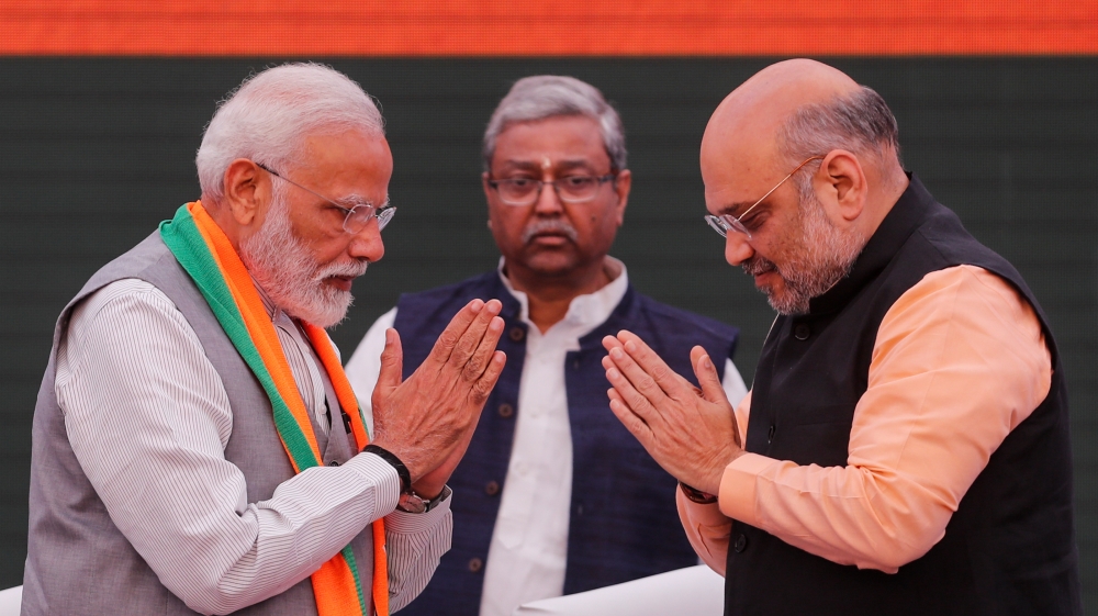 Indian Prime Minister Narendra Modi and chief of India''s ruling Bharatiya Janata Party (BJP) Amit Shah, greet each other before releasing their party''s election manifesto for the April/May general ele