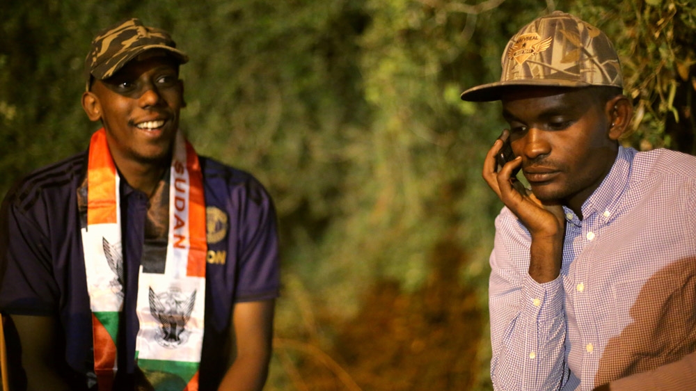 Gafar Abdulhafeez, left, and Yasir Ghazi, right, left their houses and went into hiding after the protests began in Wad Nobawi [Abdulgadir Bashir/Al Jazeera]