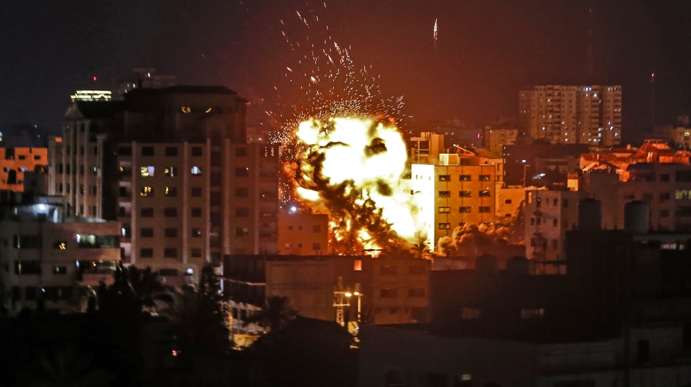 An explosion is pictured among buildings during an Israeli airstike on Gaza City on May 4, 2019.