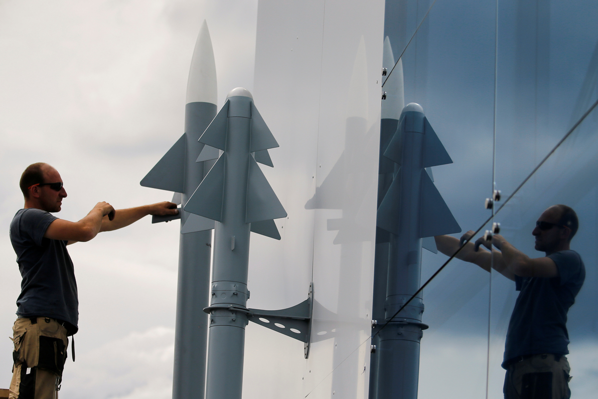 A worker installs two Rafael Air Missile Defence models, before the opening of the 53rd Paris Air Show at Le Bourget Airport near Paris, France June 14 2019. REUTERS/Pascal Rossignol