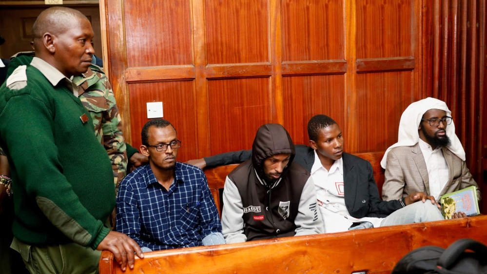 Suspects Hassan Aden Hassan, Mohamed Ali Abdikar, Rashid Charles Mberesero and Sahal Diriye sit in the dock as they wait for the verdict at the Milimani Law Courts in Nairobi