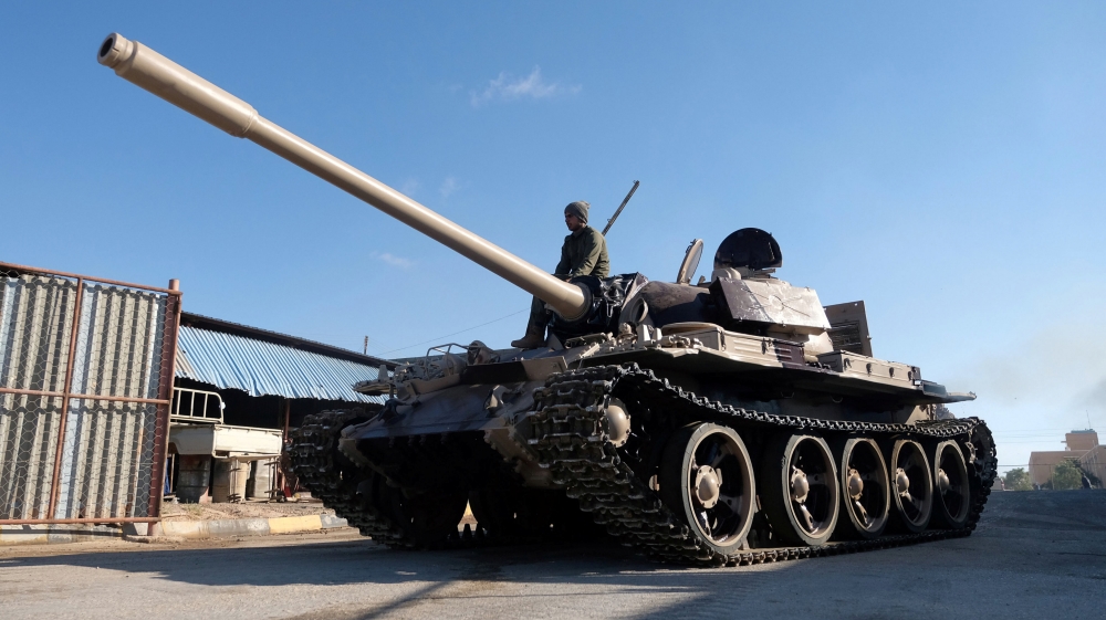 Members of Libyan National Army (LNA) commanded by Khalifa Haftar, get ready before heading out of Benghazi to reinforce the troops advancing to Tripoli, in Benghazi