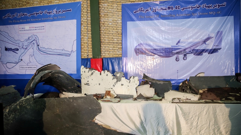 The purported wreckage of the American drone is seen displayed by the Islamic Revolution Guards Corps (IRGC) in Tehran