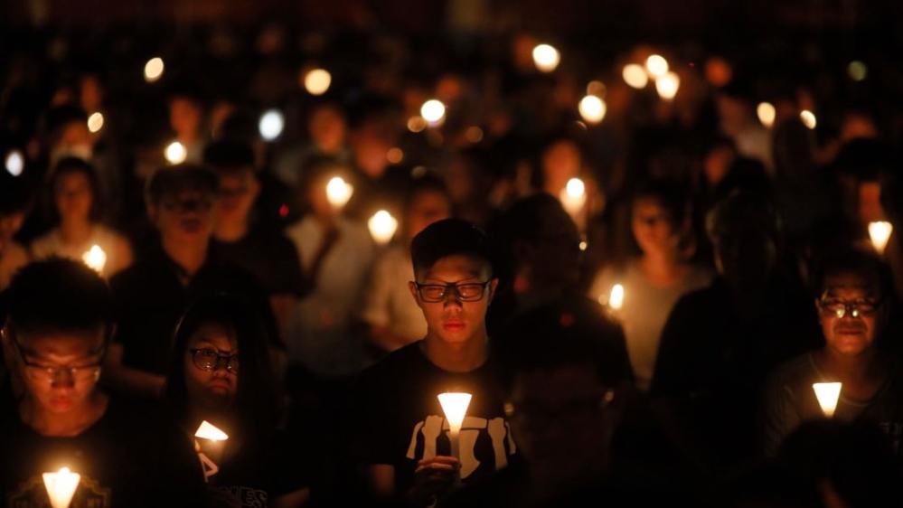 Tiananmen Square: Tens of thousands attend an annual candlelight vigil at Hong Kong's Victoria Park 