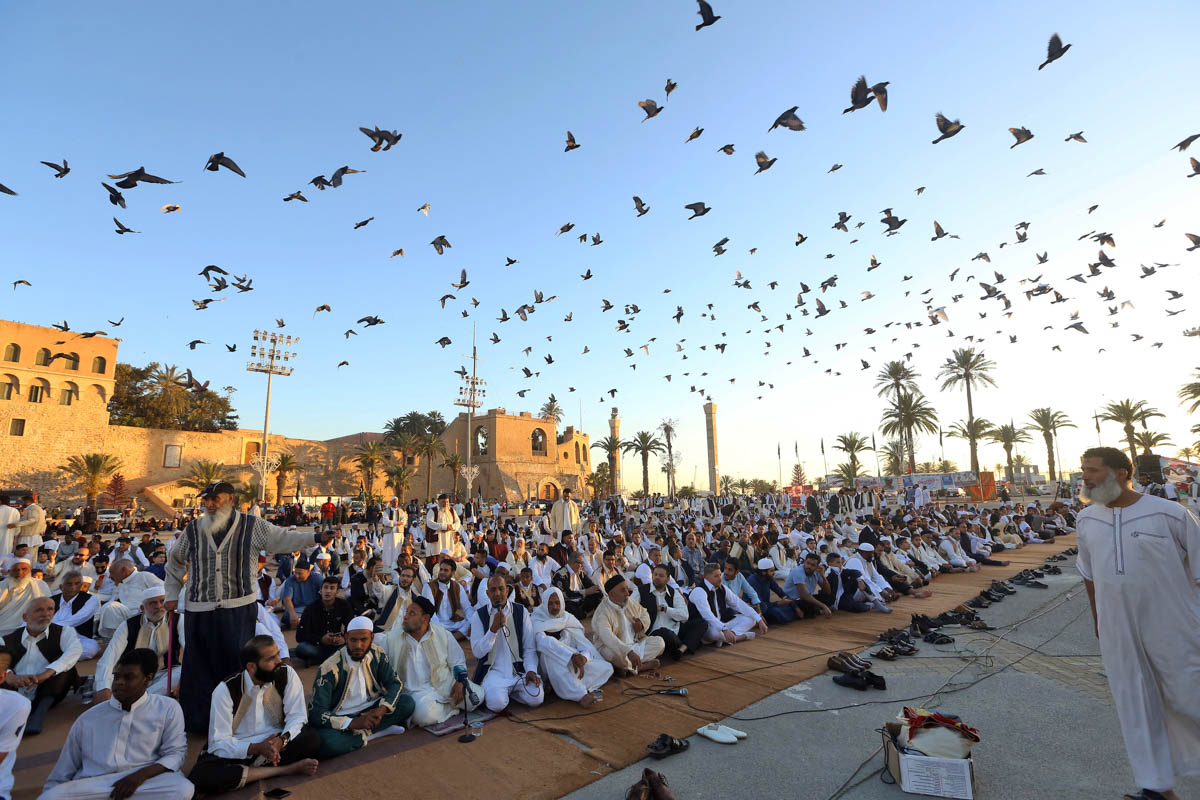 Libyan Muslim worshippers gather to perform Eid al-Fitr prayers at the Martyrs Square of the capital Tripoli on June 4, 2019. Muslims worldwide celebrate Eid al-Fitr marking the end of the Muslim holy