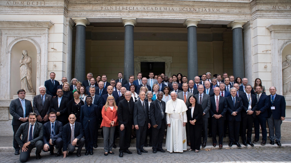 Pope Francis poses for a photograph with energy representatives at the end of a two-day meeting at the Academy of Sciences, at the Vatican