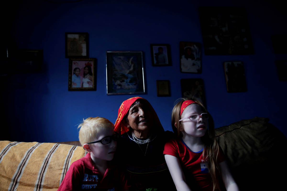 Dylan Morris (L), aged 8, his grandmother Aura Perez (C), aged 81, and his friend Brenda Hawkins (R), aged 6, during a family gathering in the Panama Oeste province, Panama, 05 June 2019. The indigeno