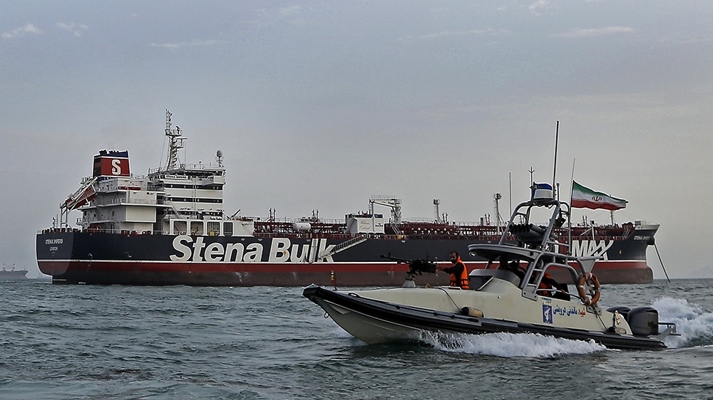 A picture taken on July 21, 2019, shows Iranian Revolutionary Guards patrolling around the British-flagged tanker Stena Impero as it''s anchored off the Iranian port city of Bandar Abbas. - Iran warned