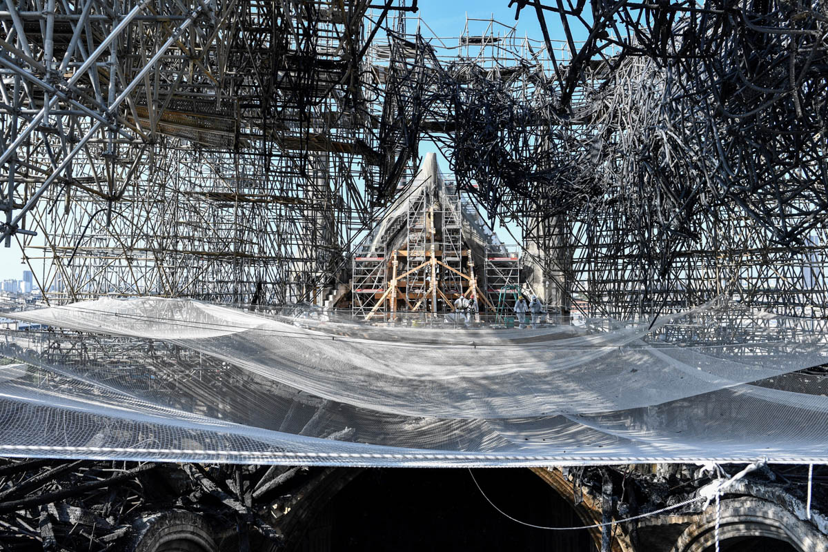 Parts of a destroyed ribbed vault and scaffolding are seen during preliminary work in the Notre-Dame de Paris Cathedral three months after a major fire on July 17, 2019 in Paris. French MPs on July 16