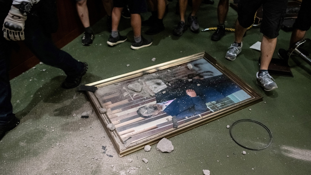 The portrait of chairman of the Legislative Council Andrew Leung is destroyed after protesters broke into the parliament chamber of the government headquarters in Hong Kong on July 1, 2019, on the 22n