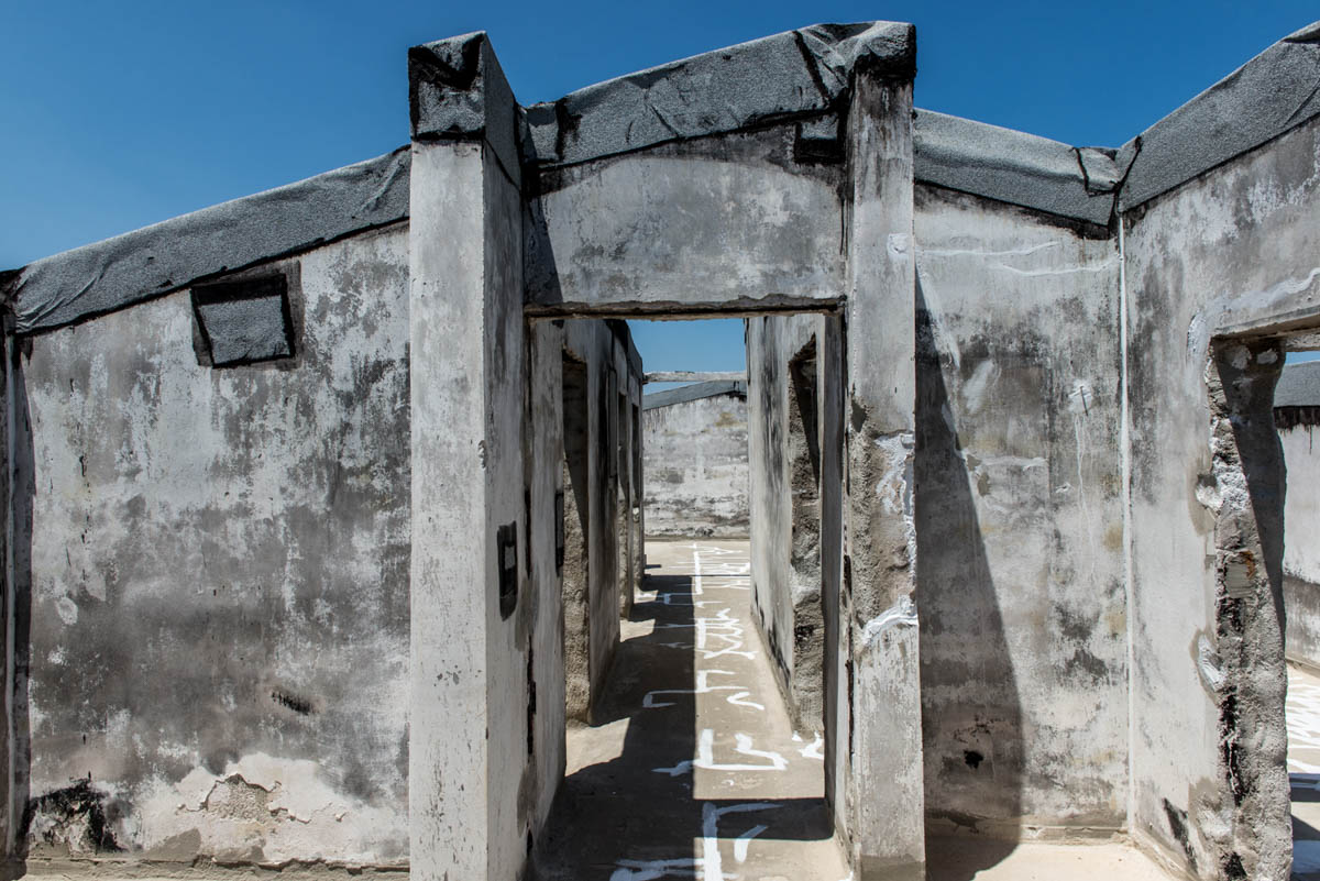 According to a monitoring group, about 3,000 buildings were damaged or totally destroyed in the fire. So far, there have been fewer than 900 applications to obtain the license needed for owners to pro