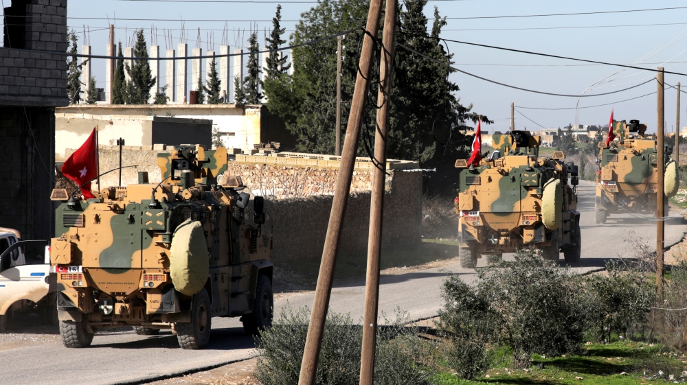 Turkish military vehicles drive at Manbij countryside