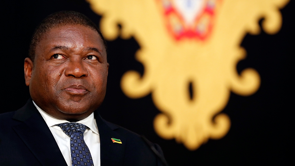 Mozambique President Filipe Nyusi listens to his Portuguese counterpart Marcelo Rebelo de Sousa addressing journalists after their meeting at the Belem presidential palace in Lisbon Tuesday, July 2, 2