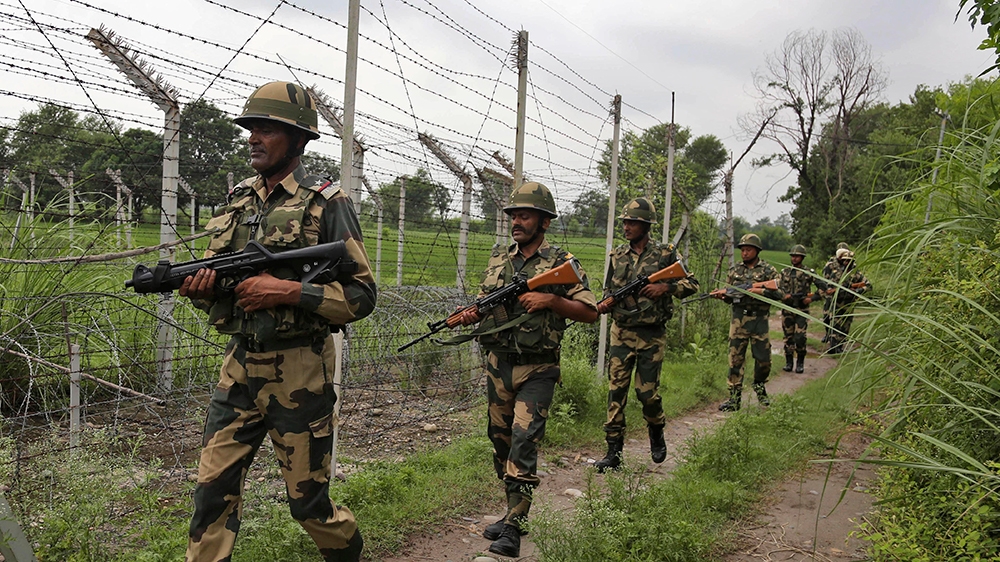 ndia’s Border Security Force (BSF) soldiers patrol near the India-Pakistan international border fencing at Garkhal in Akhnoor, 35 kilometers (22 miles) west of Jammu, India, Tuesday, Aug.13,2019. (AP