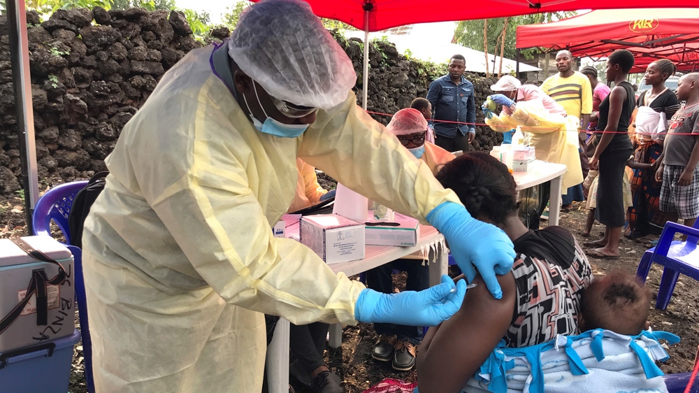 A Congolese health worker administers ebola vaccination to a resident at a centre in Goma
