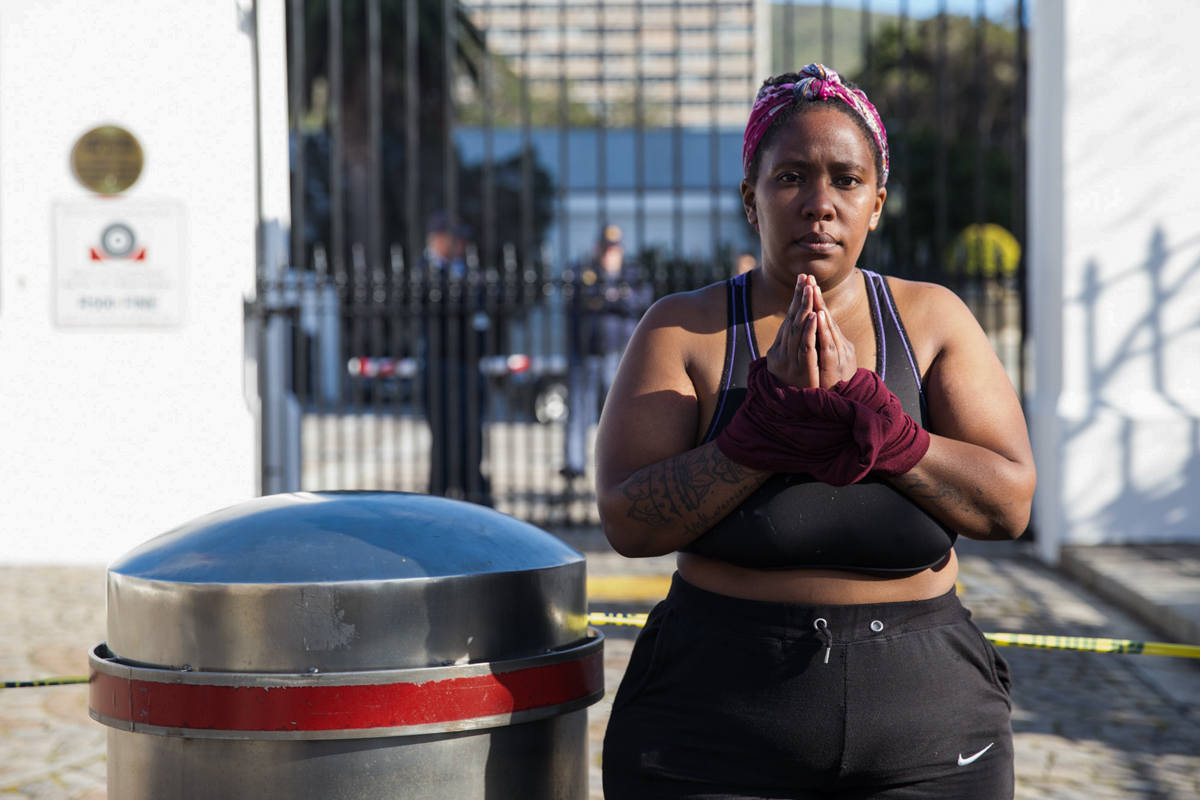 “We are tied up. We are living in fear. And the only people who can untie us from the fears that we are facing is the government” said Imogen Vollenhoven, a protester that has tied her hands up outsid