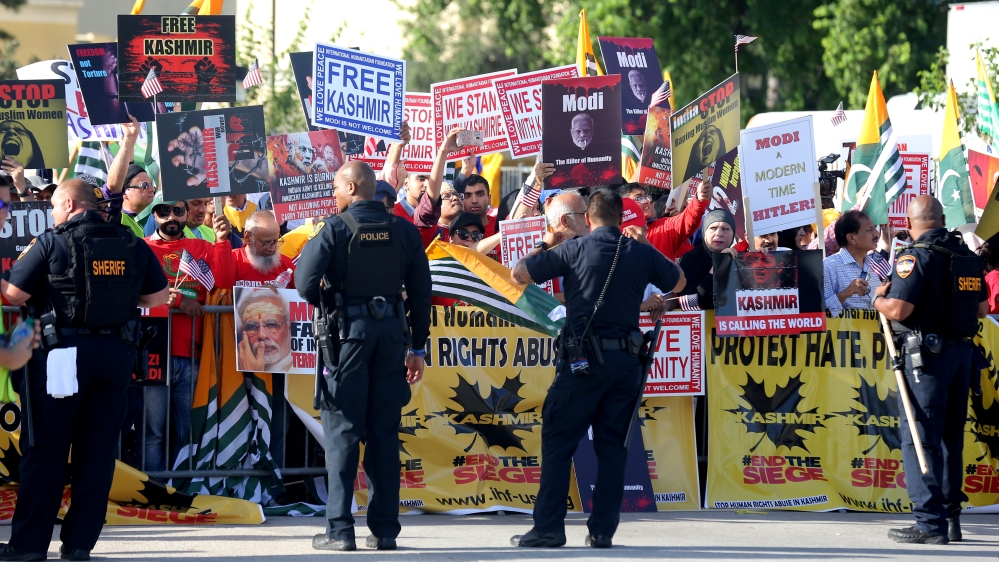 Counter-demonstrators protest during a "Howdy, Modi" rally celebrating India''s Prime Minister Narenda Modi at NRG Stadium in Houston