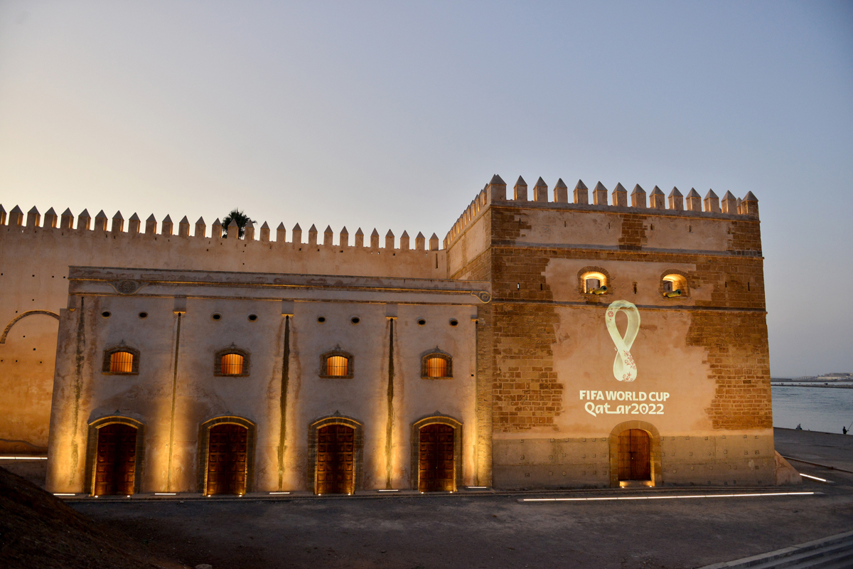 The official 2022 Fifa World Cup Qatar logo is projected on the walls of the Oudaya kasbah in the Moroccan capital Rabat on September 3, 2019. - Qatar unveiled the logo for the 2022 World Cup which wi