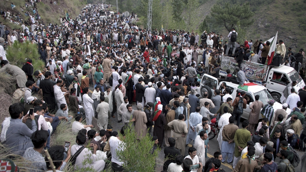 Supporters of the Jammu Kashmir Liberation Front stage a sit-in after police stop them from marching towards the Line of Control, in Jaskool, Pakistani Kashmir, Sunday, Oct. 6, 2019. Police have block