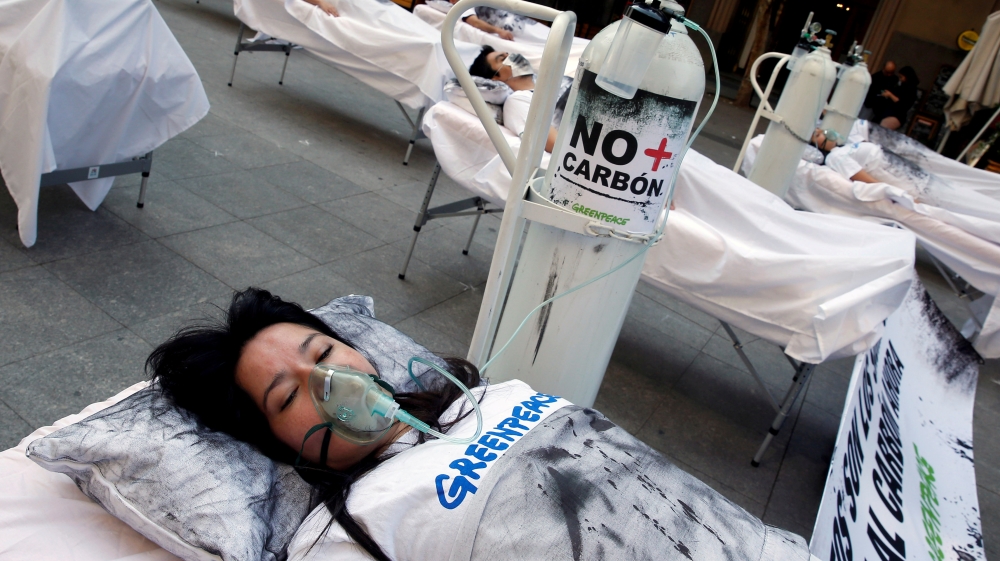 Demonstrators take part in a protest against climate change called by Greenpeace activists ahead of the 2019 United Nations Climate Change Conference, also known as COP25, in Santiago