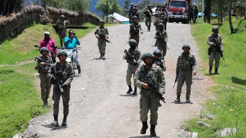 Security officers patrol in Ilaga, Puncak regency in Papua