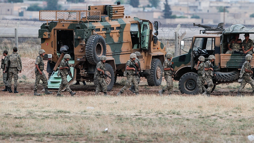 Turkish soldiers patrol the the Turkish border town of Akcakale, in Sanliurfa province, Turkey, June 15, 2015. (Photo by Gokhan Sahin/Getty Images)