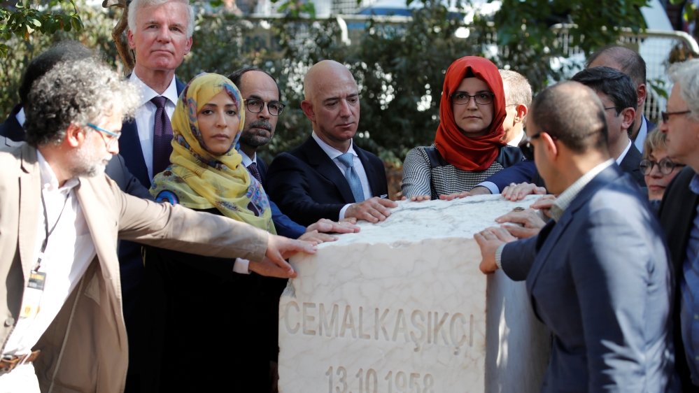 Hatice Cengiz, fiancee of the murdered Saudi journalist Jamal Khashoggi and Jeff Bezos, founder of Amazon and Blue Origin, gather around a monument during a ceremony