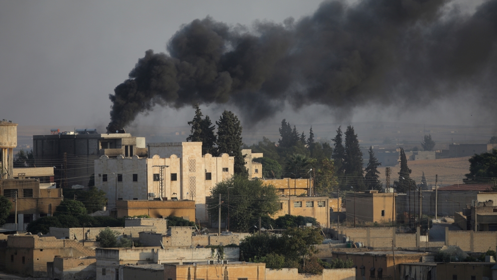 Smoke rises above the Syrian border town of Tel Abyad, as seen from Akcakale, Turkey, October 13, 2019