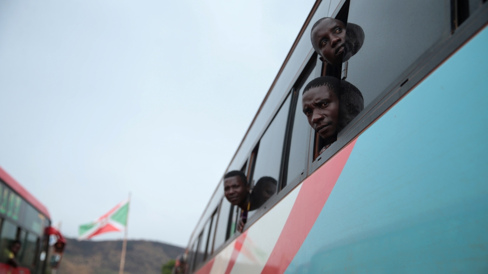 Burundian refugees look out from a bus which transported them from Tanzania to neighbouring Burundi, as part of a repartition program, in Burundi