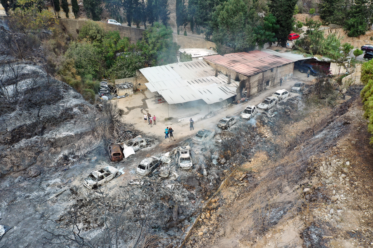 A picture taken with a drone shows an aerial view a row of burnt-out cars at Al Damour area south Beirut, Lebanon, 15 October 2019. According to reports, 18 Lebanese people were admitted to hospitals