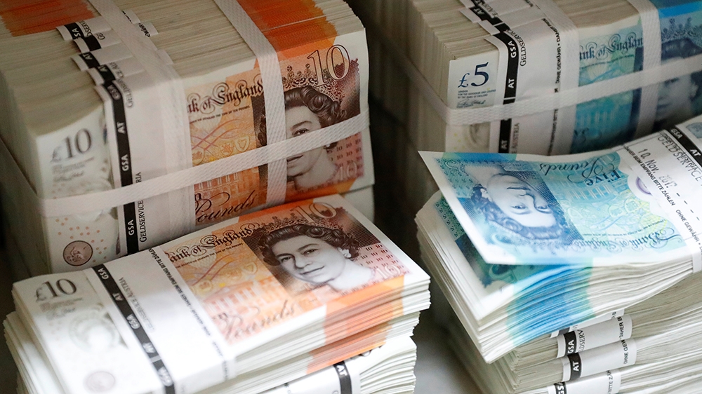 Wads of British Pound Sterling banknotes are stacked in piles at the Money Service Austria company''s headquarters in Vienna, Austria, November 16, 2017