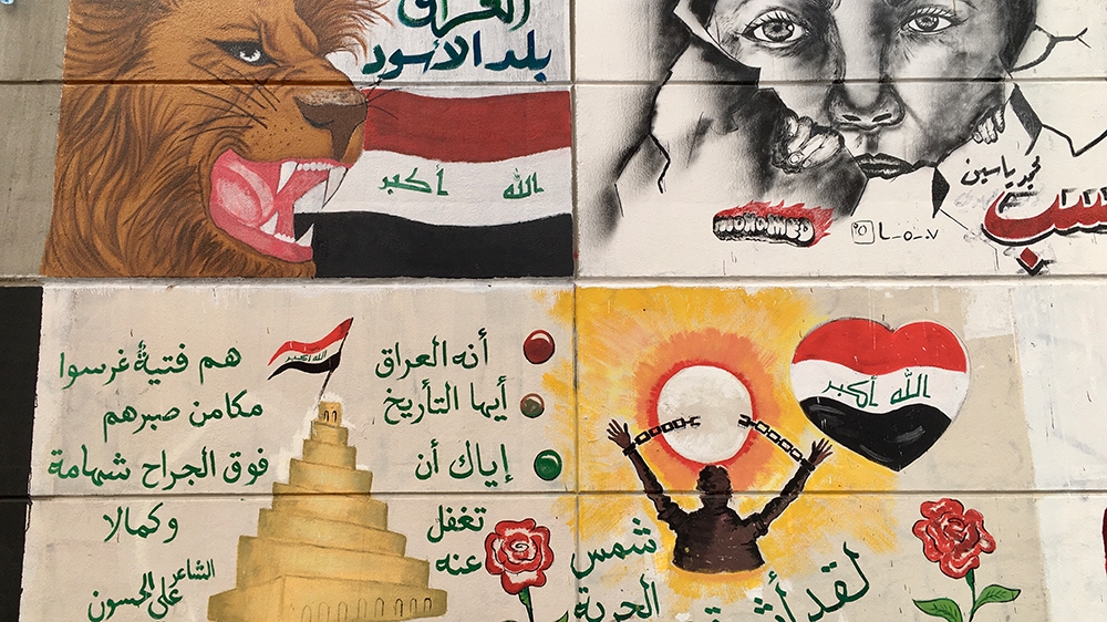  A mural inside Tahrir tunnel depicts the lion of Babylon among Iraqi flags [Sofia Barbarani/Al Jazeera]