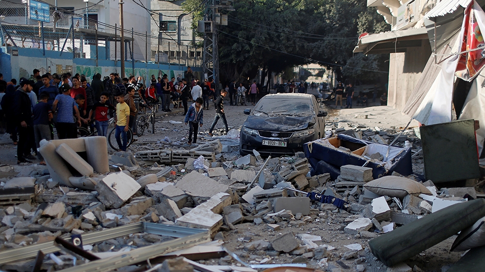 People gather near the home of Palestinian Islamic Jihad field commander Baha Abu Al-Atta after it was hit by an Israeli strike that killed him in Gaza City November 12, 2019. REUTERS/Mohammed Salem