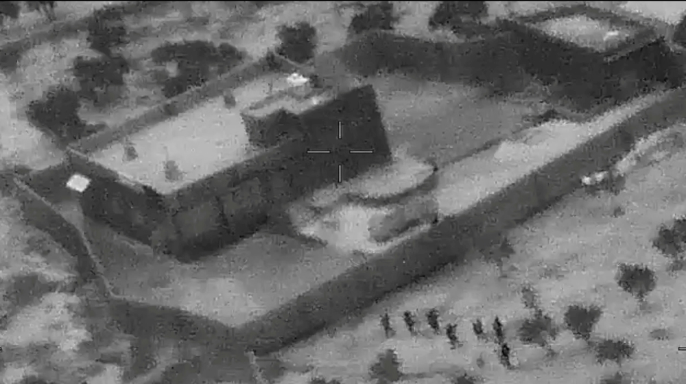U.S. special forces move towards the compound of Islamic State leader Abu Bakr al-Baghdadi during a raid in the Idlib region of Syria