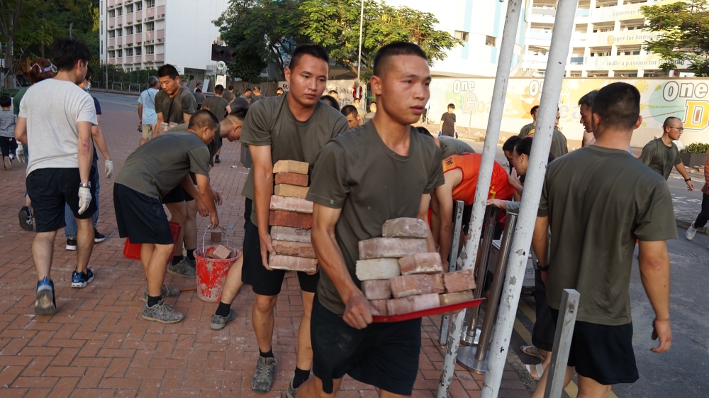 Personnel from the Chinese People''s Liberation Army barracks in Hong Kong emerged on to the city streets on November 16, 2019, to help the clean-up
